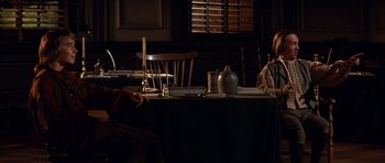 Movie still from “1776” (1972), directed by Peter H. Hunt – A table set for a meal in the dark; Medium shot, High angle