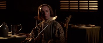 Movie still from “1776” (1972), directed by Peter H. Hunt – A man with long brown hair holding a sword; Medium shot, Low angle