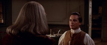 Movie still from “1776” (1972), directed by Peter H. Hunt – A man and a woman are talking to each other in a room; Medium shot, Over the shoulder angle