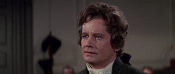 Movie still from “1776” (1972), directed by Peter H. Hunt – A person wearing a suit and tie; Close Up shot, Over the shoulder angle