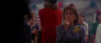 Movie still from “1941” (1979), directed by Steven Spielberg – A group of people standing in a room; Close Up shot, Over the shoulder angle