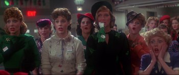 Movie still from “1941” (1979), directed by Steven Spielberg – A group of women standing next to each other in a room; Medium shot, Low angle