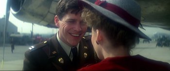Movie still from “1941” (1979), directed by Steven Spielberg – A man in a uniform talking to a young boy; Close Up shot, Over the shoulder angle