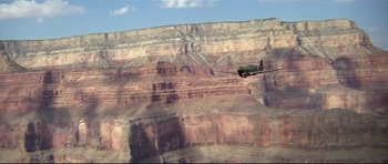 Movie still from “1941” (1979), directed by Steven Spielberg – An airplane flying over a cliff in the grand canyon; Extreme Wide shot, High angle