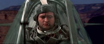 Movie still from “1941” (1979), directed by Steven Spielberg – A person wearing a pilot's helmet; Close Up shot, Low angle