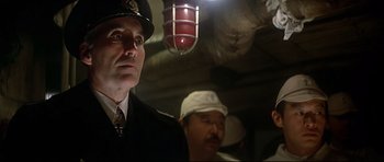 Movie still from “1941” (1979), directed by Steven Spielberg – A man in a uniform is looking at the camera; Close Up shot, Low angle