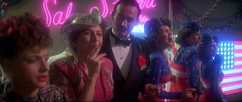 Movie still from “1941” (1979), directed by Steven Spielberg – A group of people standing next to each other in a room; Medium shot, Low angle