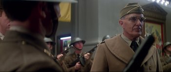 Movie still from “1941” (1979), directed by Steven Spielberg – A group of men in uniforms holding guns; Close Up shot, Low angle