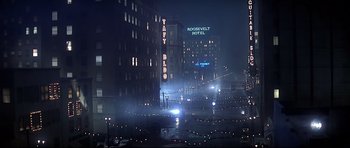 Movie still from “1941” (1979), directed by Steven Spielberg – A city street at night lit up by street lights; Extreme Wide shot, High angle