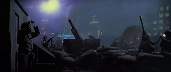 Movie still from “1941” (1979), directed by Steven Spielberg – A group of people sitting in a dark room; Wide shot, Low angle