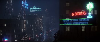 Movie still from “1941” (1979), directed by Steven Spielberg – A view of a city at night from across the street; Extreme Wide shot, Low angle