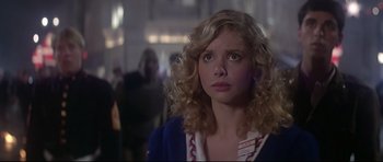 Movie still from “1941” (1979), directed by Steven Spielberg – A woman with blonde curly hair stares into the distance; Close Up shot, Low angle