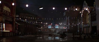 Movie still from “1941” (1979), directed by Steven Spielberg – A car parked in the middle of a parking lot at night; Extreme Wide shot, Low angle