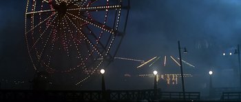 Movie still from “1941” (1979), directed by Steven Spielberg – A ferris wheel that is lit up at night; Extreme Wide shot, Low angle