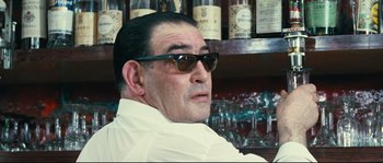 Movie still from “2 or 3 Things I Know About Her” (1967), directed by Jean-Luc Godard – A person wearing sunglasses; Close Up shot, Low angle