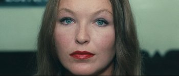 Movie still from “2 or 3 Things I Know About Her” (1967), directed by Jean-Luc Godard – A woman's face with blue eyes; Extreme Close Up shot, High angle