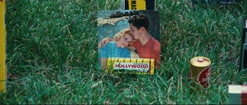 Movie still from “2 or 3 Things I Know About Her” (1967), directed by Jean-Luc Godard – A picture of a boy and a girl in the grass; Extreme Close Up shot, High angle