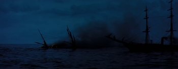 Movie still from “20,000 Leagues Under the Sea” (1954), directed by Richard Fleischer – A boat is in the water at night time; Extreme Wide shot, Low angle