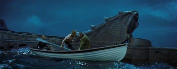 Movie still from “20,000 Leagues Under the Sea” (1954), directed by Richard Fleischer – Two people in a boat in the water; Wide shot, High angle