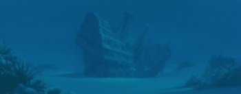 Movie still from “20,000 Leagues Under the Sea” (1954), directed by Richard Fleischer – A large ship floating on top of a body of water; Extreme Wide shot, Low angle