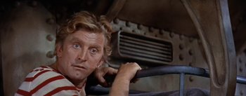 Movie still from “20,000 Leagues Under the Sea” (1954), directed by Richard Fleischer – A person leaning on a rail; Close Up shot, Low angle