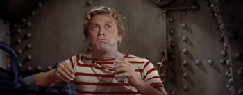 Movie still from “20,000 Leagues Under the Sea” (1954), directed by Richard Fleischer – A man in a striped shirt holding a glass of water; Close Up shot, High angle