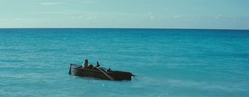 Movie still from “20,000 Leagues Under the Sea” (1954), directed by Richard Fleischer – A man in a boat in the ocean; Extreme Wide shot, High angle