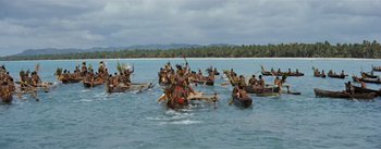Movie still from “20,000 Leagues Under the Sea” (1954), directed by Richard Fleischer – A large group of people in canoes on a body of water; Extreme Wide shot, High angle