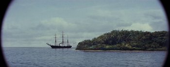 Movie still from “20,000 Leagues Under the Sea” (1954), directed by Richard Fleischer – A boat in the water near the shore; Extreme Wide shot, High angle
