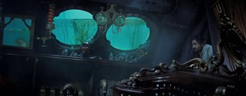 Movie still from “20,000 Leagues Under the Sea” (1954), directed by Richard Fleischer – A view of a submarine from inside a ship; Wide shot, High angle