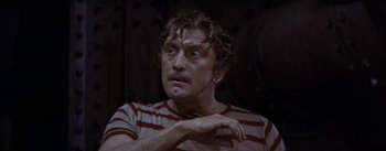 Movie still from “20,000 Leagues Under the Sea” (1954), directed by Richard Fleischer – A person wearing a striped shirt; Close Up shot, Low angle