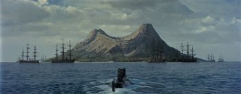 Movie still from “20,000 Leagues Under the Sea” (1954), directed by Richard Fleischer – An image of a boat in the water with a mountain in the background; Extreme Wide shot, High angle