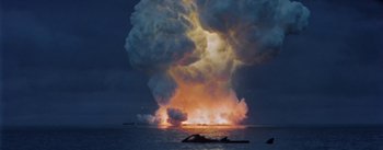 Movie still from “20,000 Leagues Under the Sea” (1954), directed by Richard Fleischer – An explosion in the ocean with a boat in the background; Extreme Wide shot, Low angle