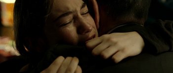 Movie still from “22 Bullets” (2010), directed by Richard Berry – A person holding another person's hand; Close Up shot, Over the shoulder angle