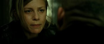 Movie still from “22 Bullets” (2010), directed by Richard Berry – A person looking at a camera; Close Up shot, Over the shoulder angle