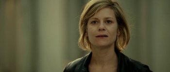 Movie still from “22 Bullets” (2010), directed by Richard Berry – A person with short hair; Close Up shot, Low angle