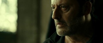 Movie still from “22 Bullets” (2010), directed by Richard Berry – A person looking at the camera; Close Up shot, Over the shoulder angle