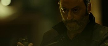 Movie still from “22 Bullets” (2010), directed by Richard Berry – A person with a beard; Close Up shot, Low angle