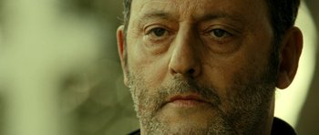 Movie still from “22 Bullets” (2010), directed by Richard Berry – A man's face with a beard; Extreme Close Up shot, Low angle