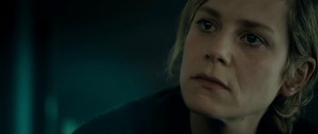 Movie still from “22 Bullets” (2010), directed by Richard Berry – A woman's face in the dark; Close Up shot, Over the shoulder angle
