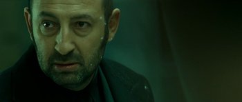 Movie still from “22 Bullets” (2010), directed by Richard Berry – A person wearing a jacket; Close Up shot, Low angle