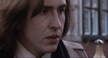 Movie still from “24 Hour Party People” (2002), directed by Tom Bruggen – A person with long hair; Close Up shot, Low angle