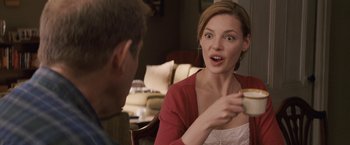 Movie still from “27 Dresses” (2008), directed by Anne Fletcher – A man and a woman sitting at a table talking to each other; Close Up shot, Over the shoulder angle