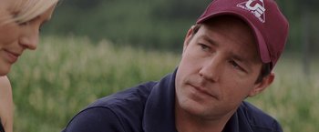 Movie still from “27 Dresses” (2008), directed by Anne Fletcher – A person wearing a hat; Close Up shot, Over the shoulder angle