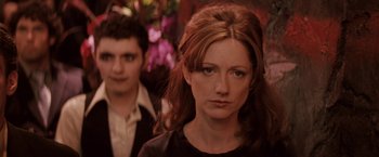 Movie still from “27 Dresses” (2008), directed by Anne Fletcher – A person wearing a black shirt; Close Up shot, Over the shoulder angle