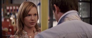 Movie still from “27 Dresses” (2008), directed by Anne Fletcher – A man and a woman are talking to each other; Close Up shot, Over the shoulder angle