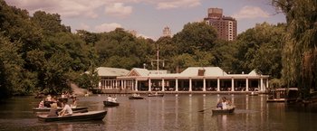 Movie still from “27 Dresses” (2008), directed by Anne Fletcher – A group of people on boats in a body of water; Extreme Wide shot, High angle