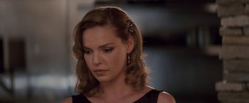 Movie still from “27 Dresses” (2008), directed by Anne Fletcher – A person wearing a dress; Close Up shot, Over the shoulder angle