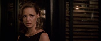 Movie still from “27 Dresses” (2008), directed by Anne Fletcher – A person wearing a black dress; Close Up shot, Over the shoulder angle