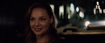 Movie still from “27 Dresses” (2008), directed by Anne Fletcher – A person smiling for the camera; Close Up shot, Over the shoulder angle